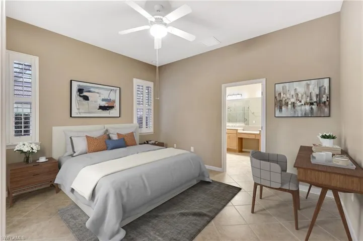 Master Bedroom featuring ensuite bath, ceiling fan, and light tile patterned flooring