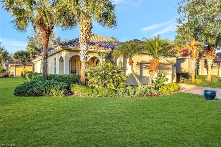 Mediterranean / spanish-style house featuring a front yard