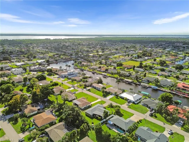 View of property location featuring nearby suburban area and a nearby body of water
