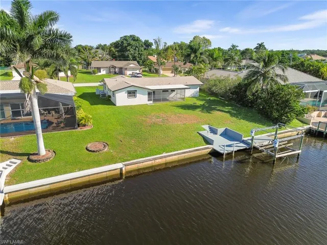 Aerial perspective of suburban area with a nearby body of water