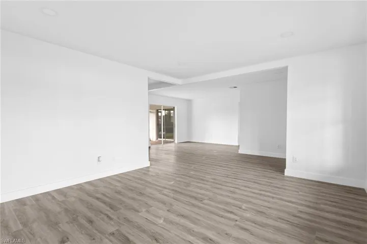 Spare room with wood finished floors and baseboards