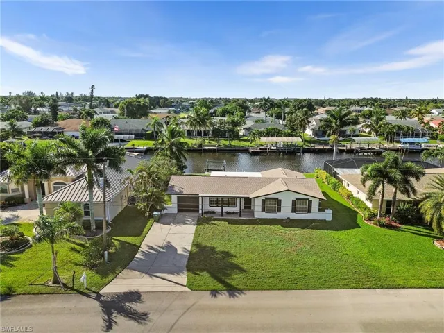 Aerial view of residential area with a large body of water