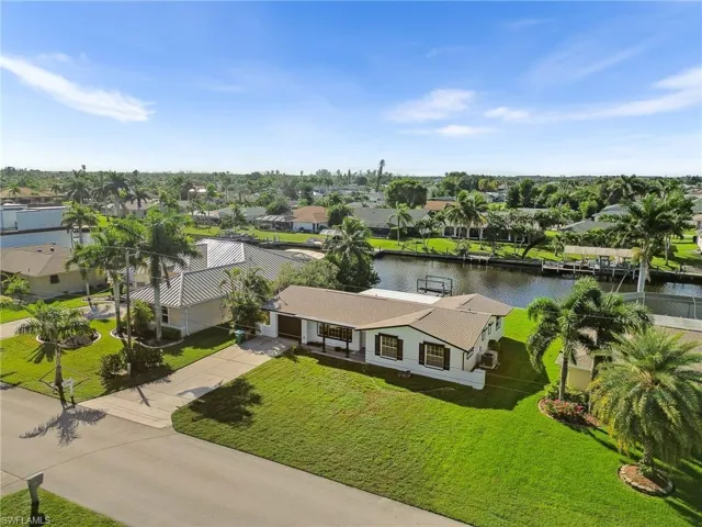 Aerial view of residential area featuring a large body of water
