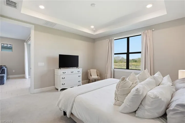 Primary bedroom with private preserve view.