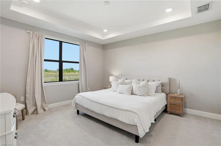 Primary bedroom with private preserve view.