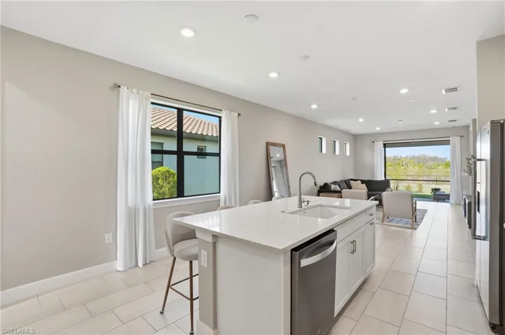 Spacious kitchen island with breakfast bar seating.