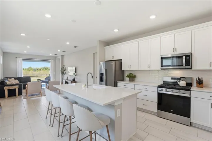Spacious kitchen island with breakfast bar seating.