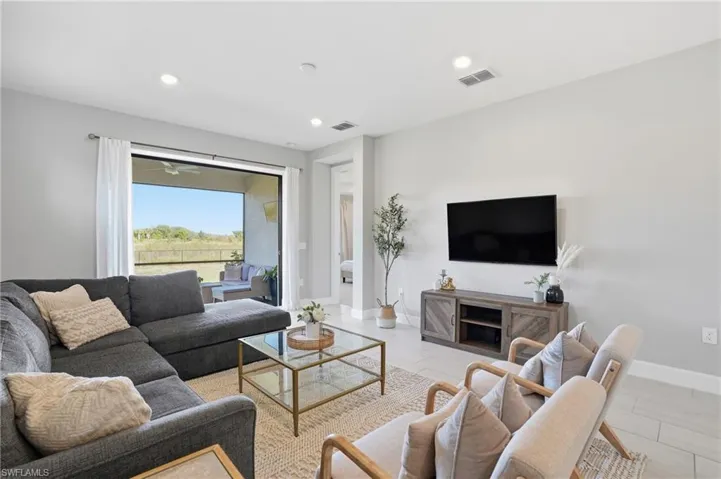 Main living area opens up to screened lanai with private preserve view.