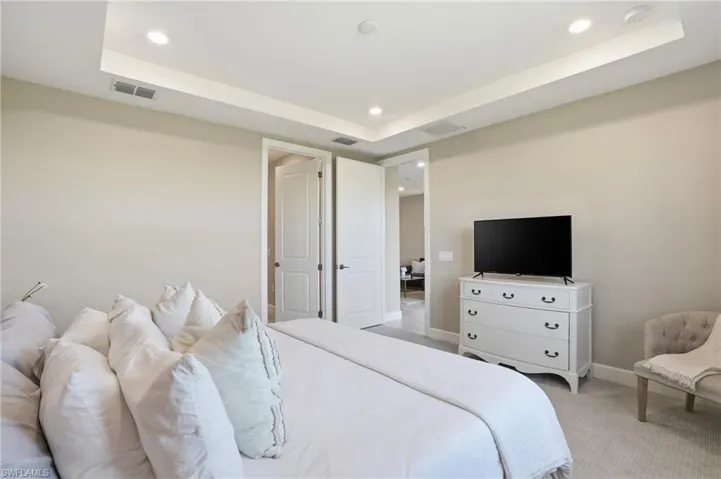 Primary bedroom with ensuite bathroom and walk-in closet.