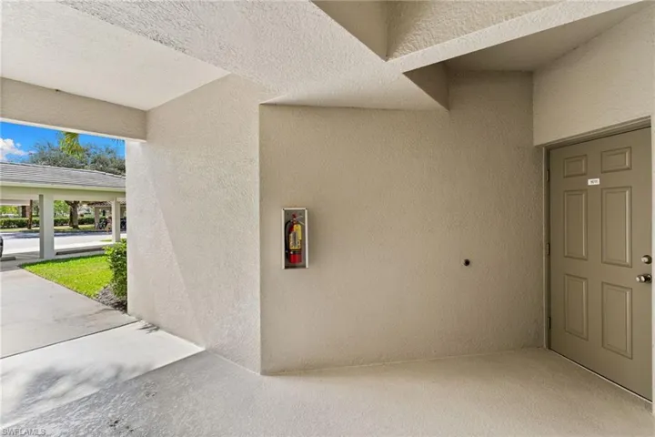 Property entrance featuring stucco siding