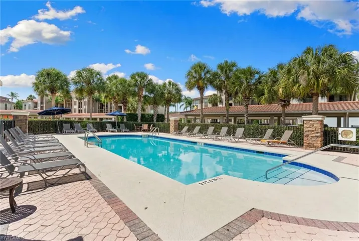 Community pool featuring a patio