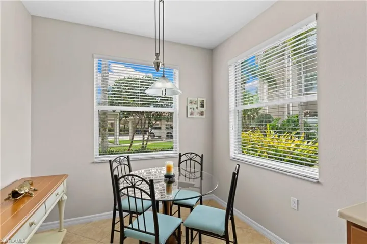 Dining room with baseboards and light tile patterned floors