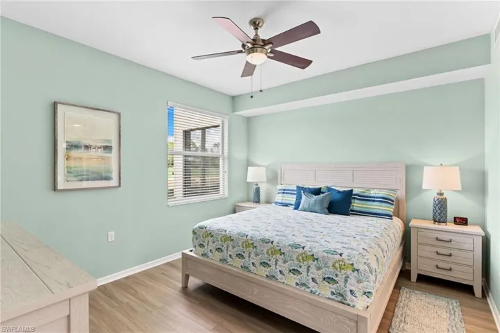 Bedroom with wood finished floors and a ceiling fan