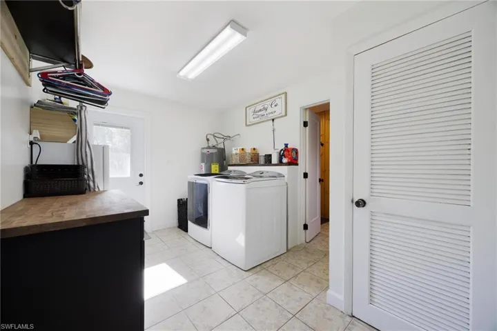 This laundry room is completed with washer and dryer.
