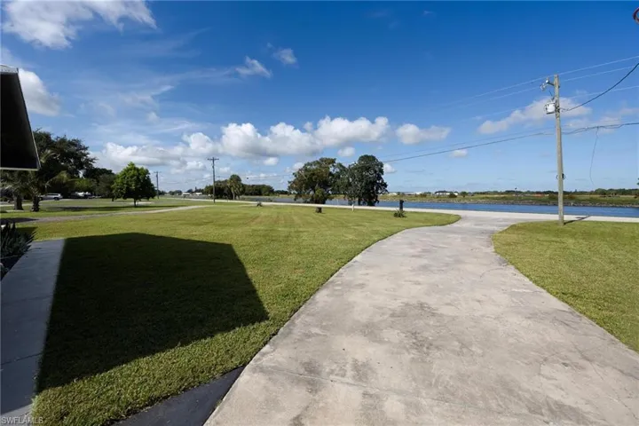 View of front yard featuring a water view, if you want a dock, with proper permitting you can achieve your dream.