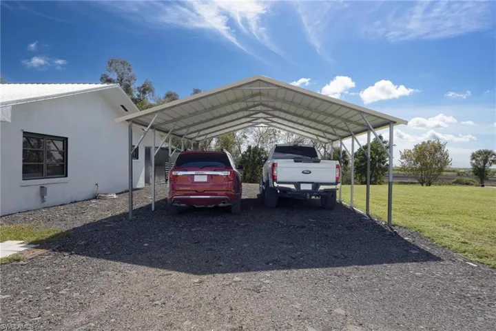 Large carport, perfect for your vehicles or a boat.