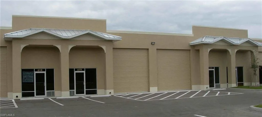 View of building exterior with community garages