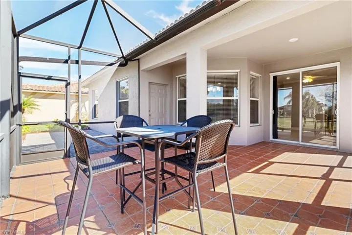 View of patio / terrace featuring a lanai