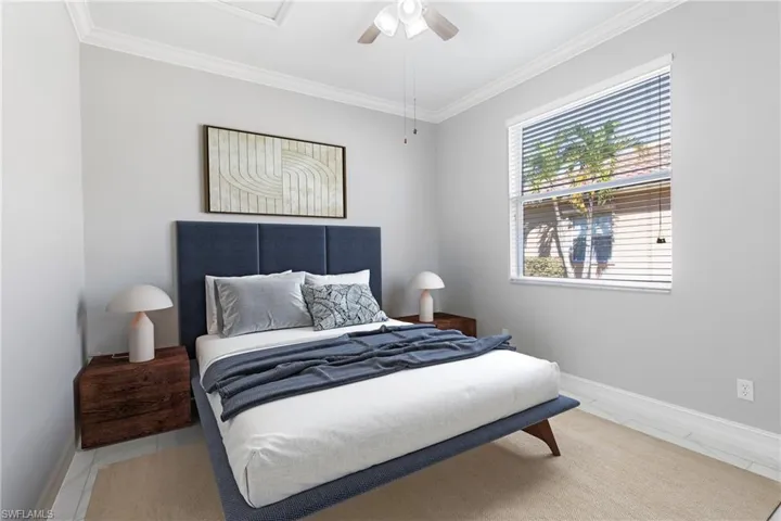 Bedroom with crown molding and ceiling fan