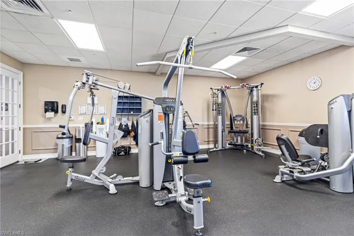Gym with a paneled ceiling