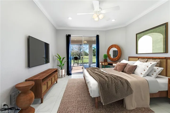 Bedroom with ornamental molding, access to exterior, and ceiling fan