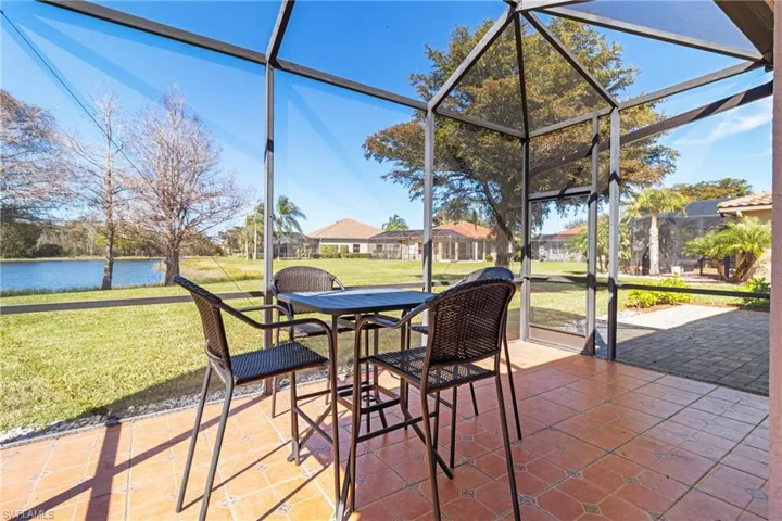 Sunroom / solarium with a water view