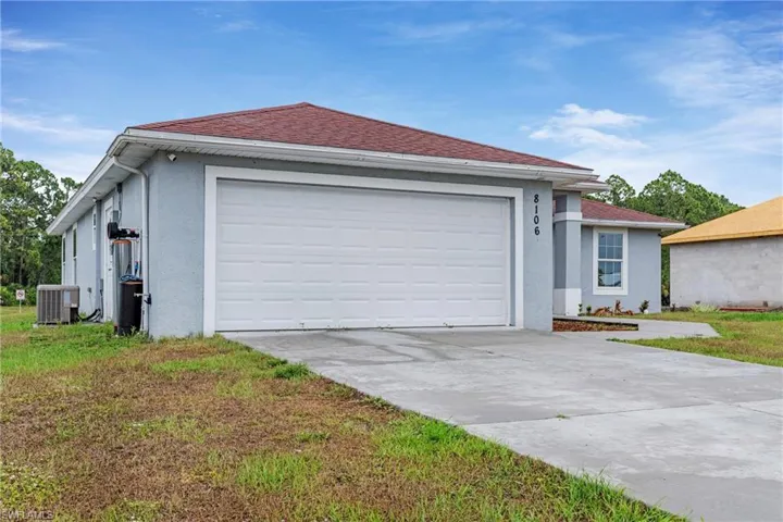 Ranch-style house featuring central air condition unit