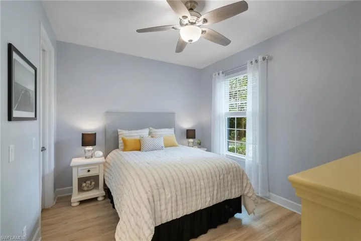 Bedroom featuring light wood-type flooring and ceiling fan