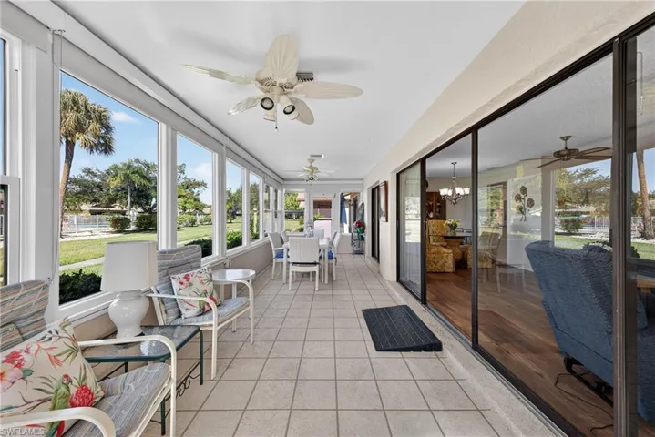 Sunroom with a ceiling fan and plenty of natural light