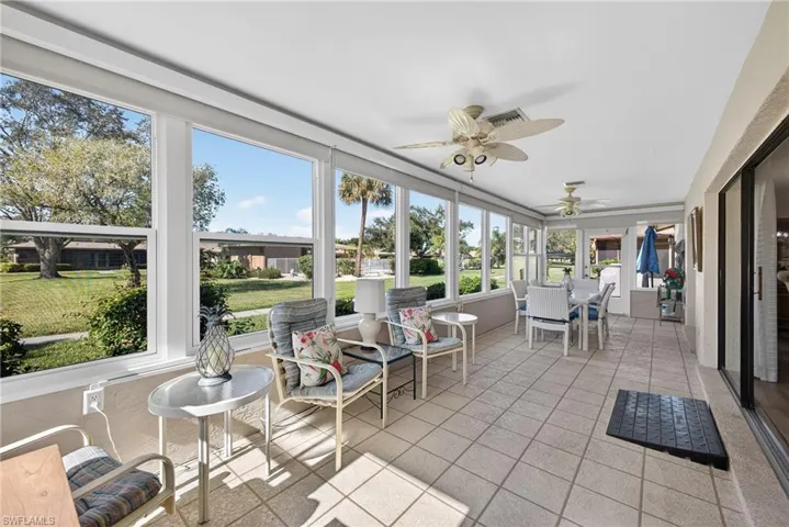 Sunroom / solarium with tile patterned flooring