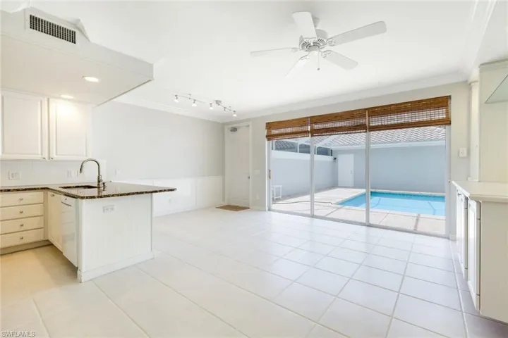 Open living area featuring direct access to a private swimming pool