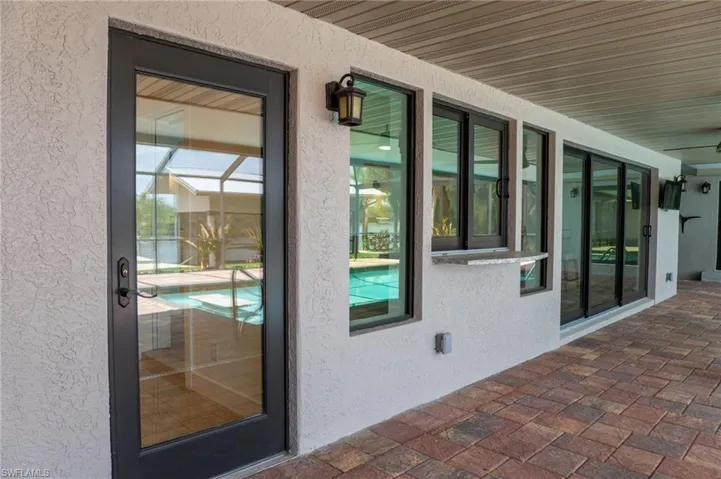 View of exterior entry featuring stucco siding