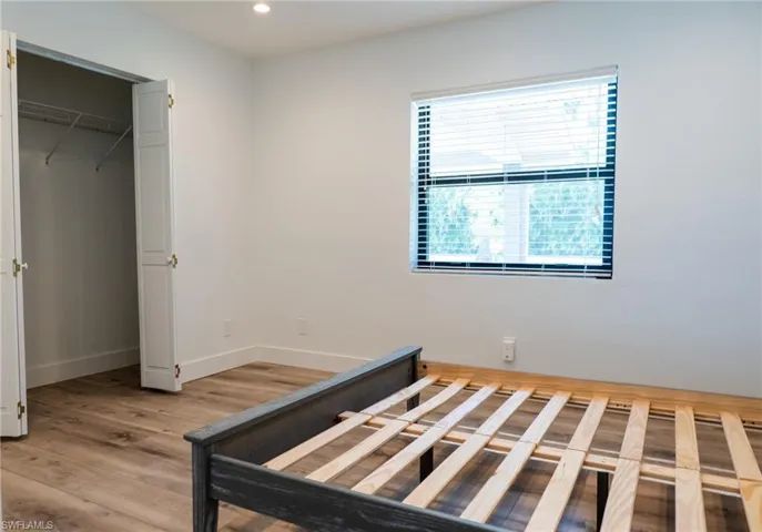 Unfurnished bedroom with baseboards, light wood finished floors, and recessed lighting