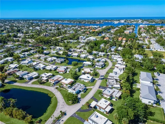 Aerial view of residential area with a nearby body of water
