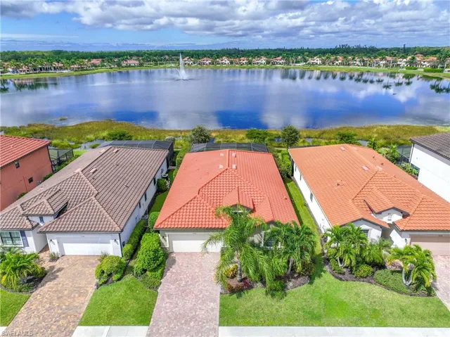 Aerial perspective of suburban area with a large body of water