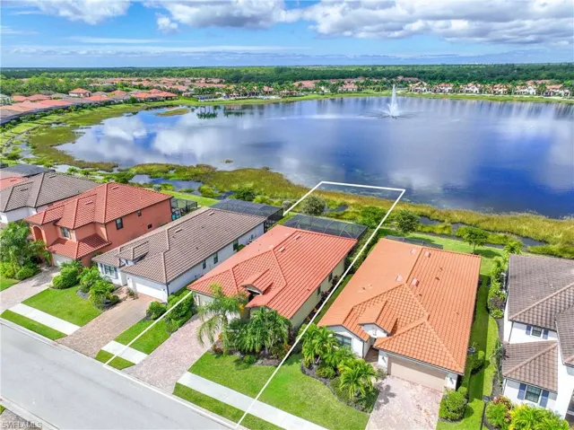 Aerial perspective of suburban area with a large body of water