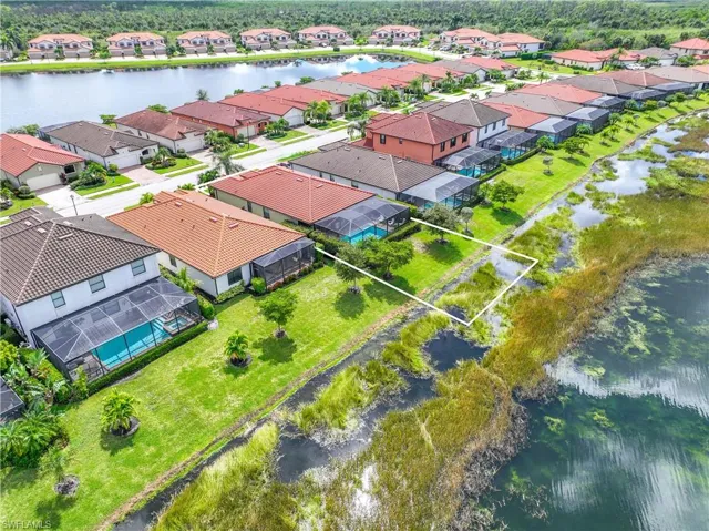 Aerial view of residential area with a large body of water
