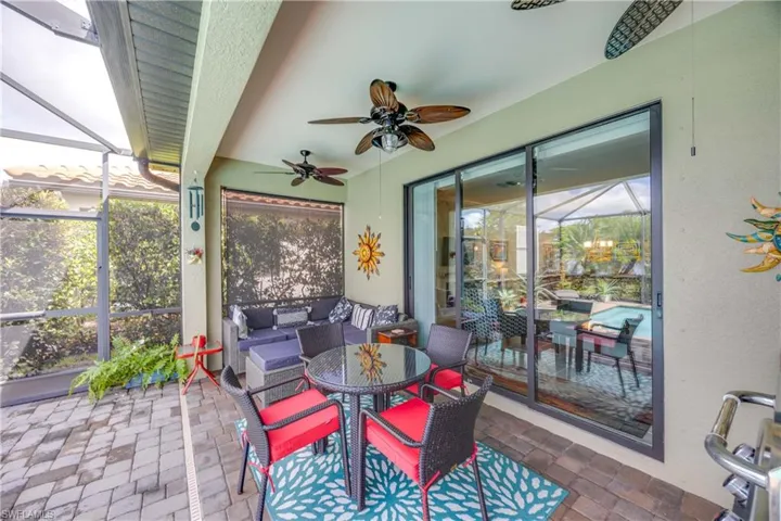 Sunroom featuring an outdoor hangout area, ceiling fan, and a patio