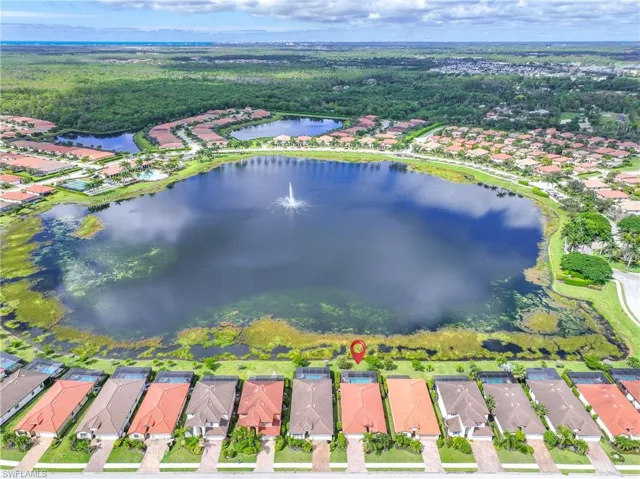 Aerial view of property's location with nearby suburban area