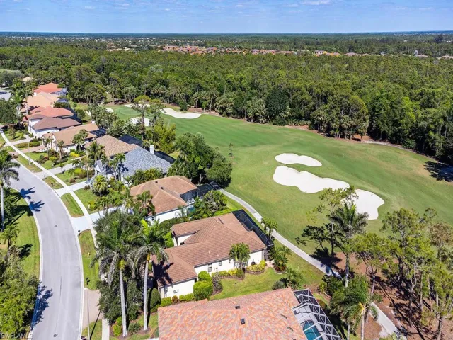 Drone / aerial view featuring a view of trees and view of golf course