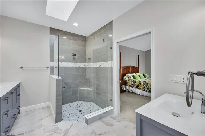 Notice the details - the tile, the vanities, the lighting and the storage!