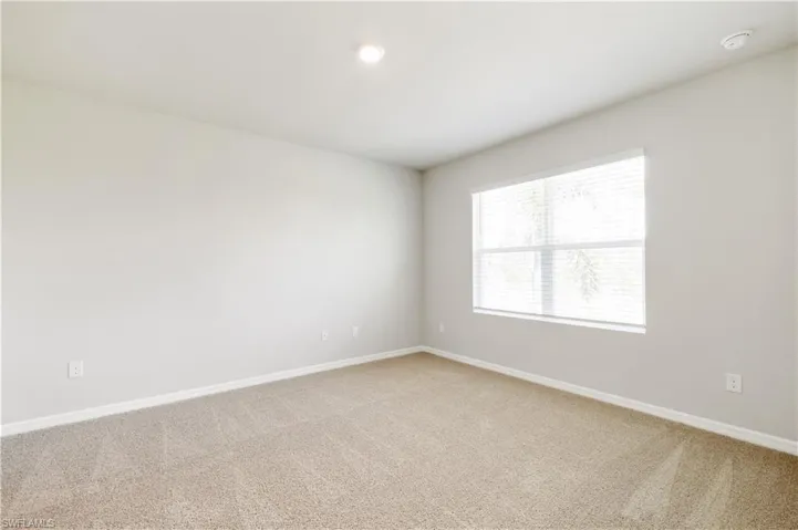 Spare room with light carpet