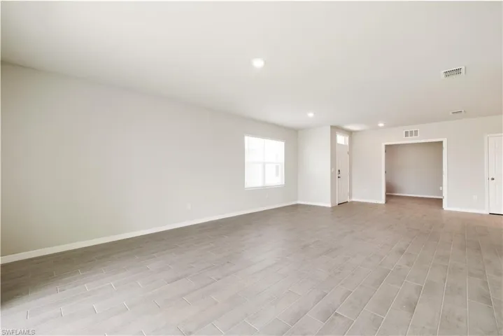 Unfurnished room with light hardwood / wood-style flooring