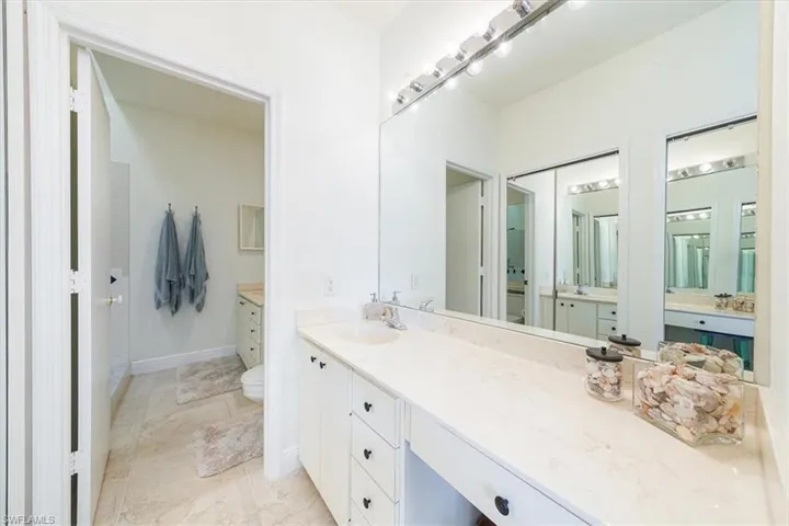 Large primary bath with dual sinks separated by door
