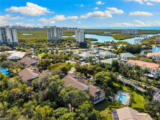 Bird's eye view of a large body of water and apartment complex / building