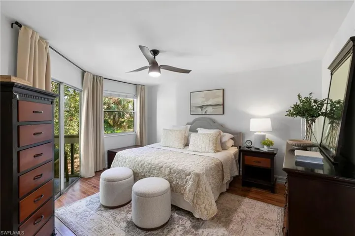Bedroom with ceiling fan and wood finished floors