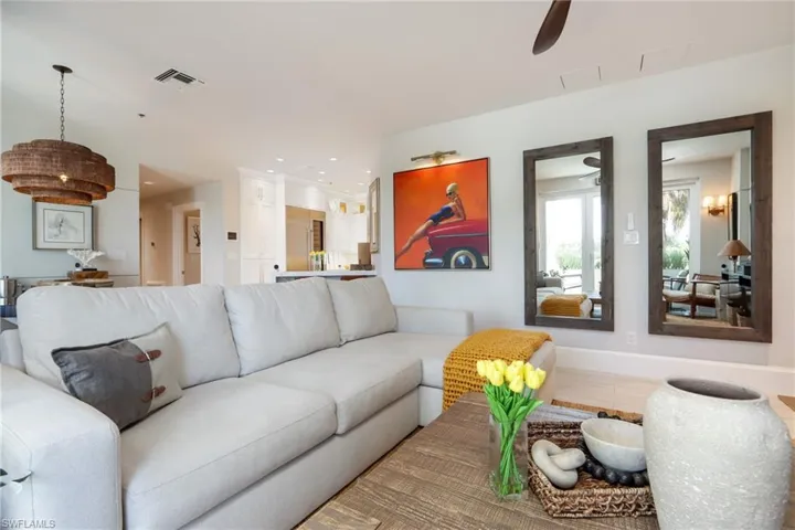 Living area featuring ceiling fan and recessed lighting