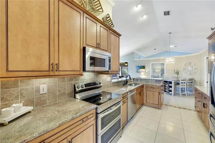 Custom wood cabinetry, granite counters, newer appliances
