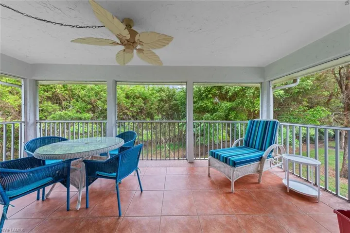 Sunroom / solarium with ceiling fan and a wealth of natural light