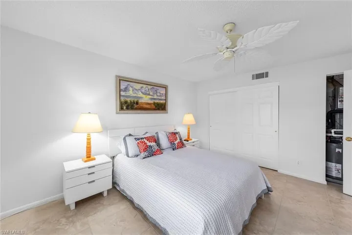 Bedroom featuring a textured ceiling, a closet, and ceiling fan